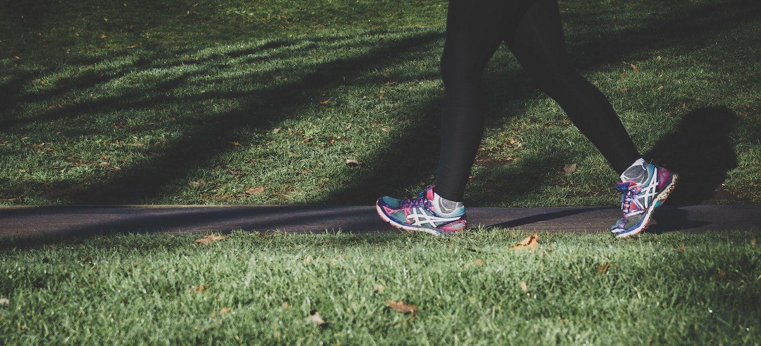 Person Walking in the Park As Part of Their Mind-Body Physical Activity Program to Manage Chronic Pain