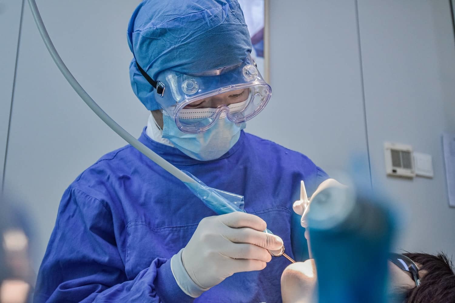 Dentist Performing an Excisional Biopsy of Oral Soft Tissue in the Mouth