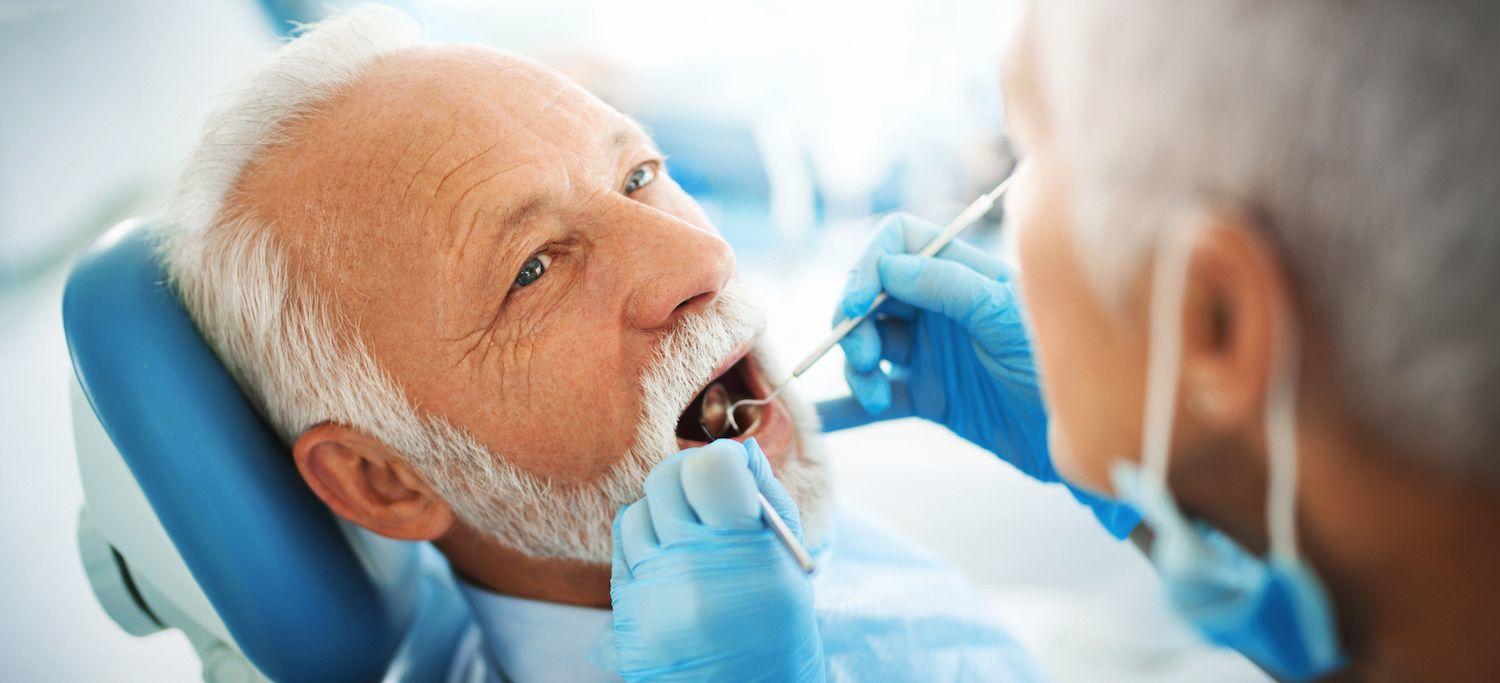 Man at the dentist receiving a checkup for his palatal myoclonus