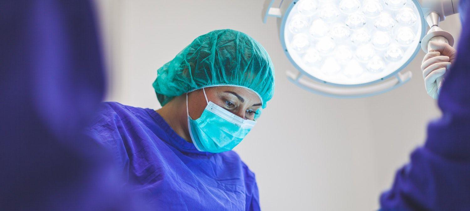 Female Doctor Performing Surgery to Treat Oromandibular Dystonia - Myectomy Pallidotomy Deep Brain Stimulation 