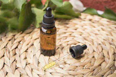 Bottle of oil on a wicker mat.